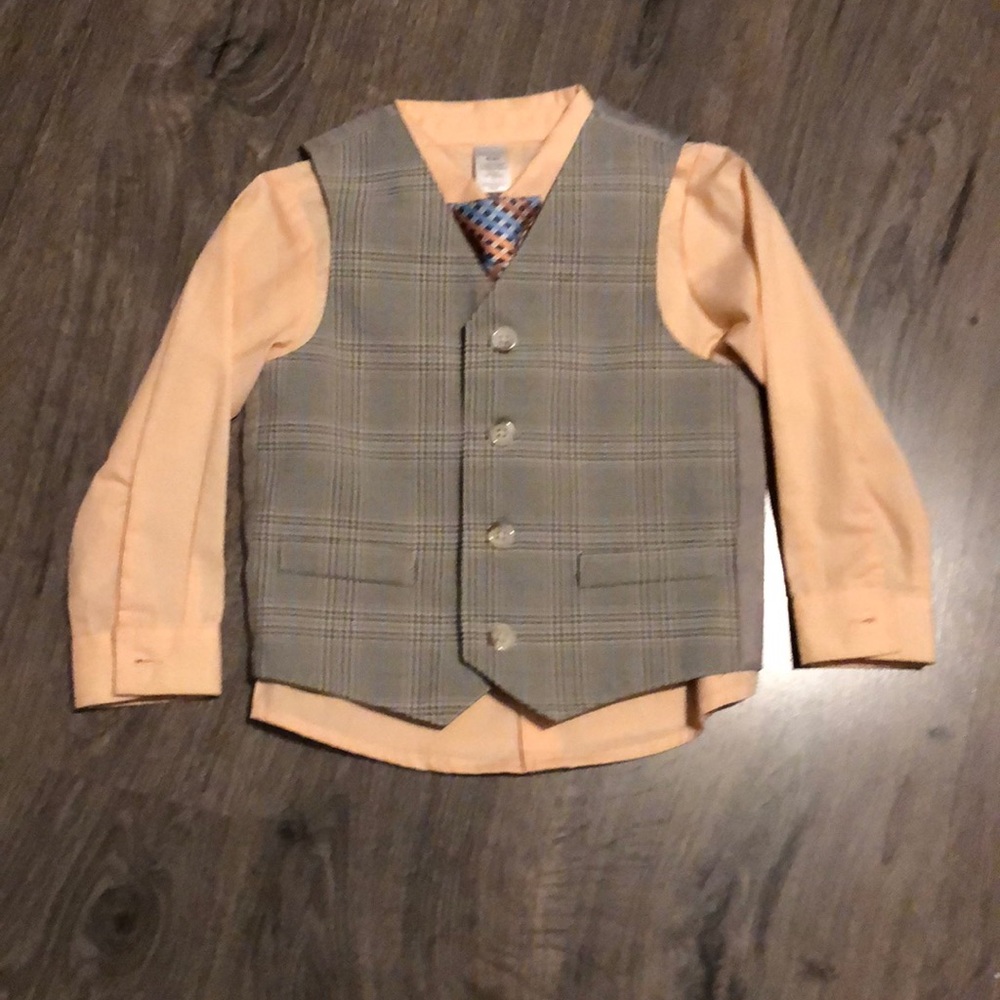 Peach button down dress shirt with vest and tie